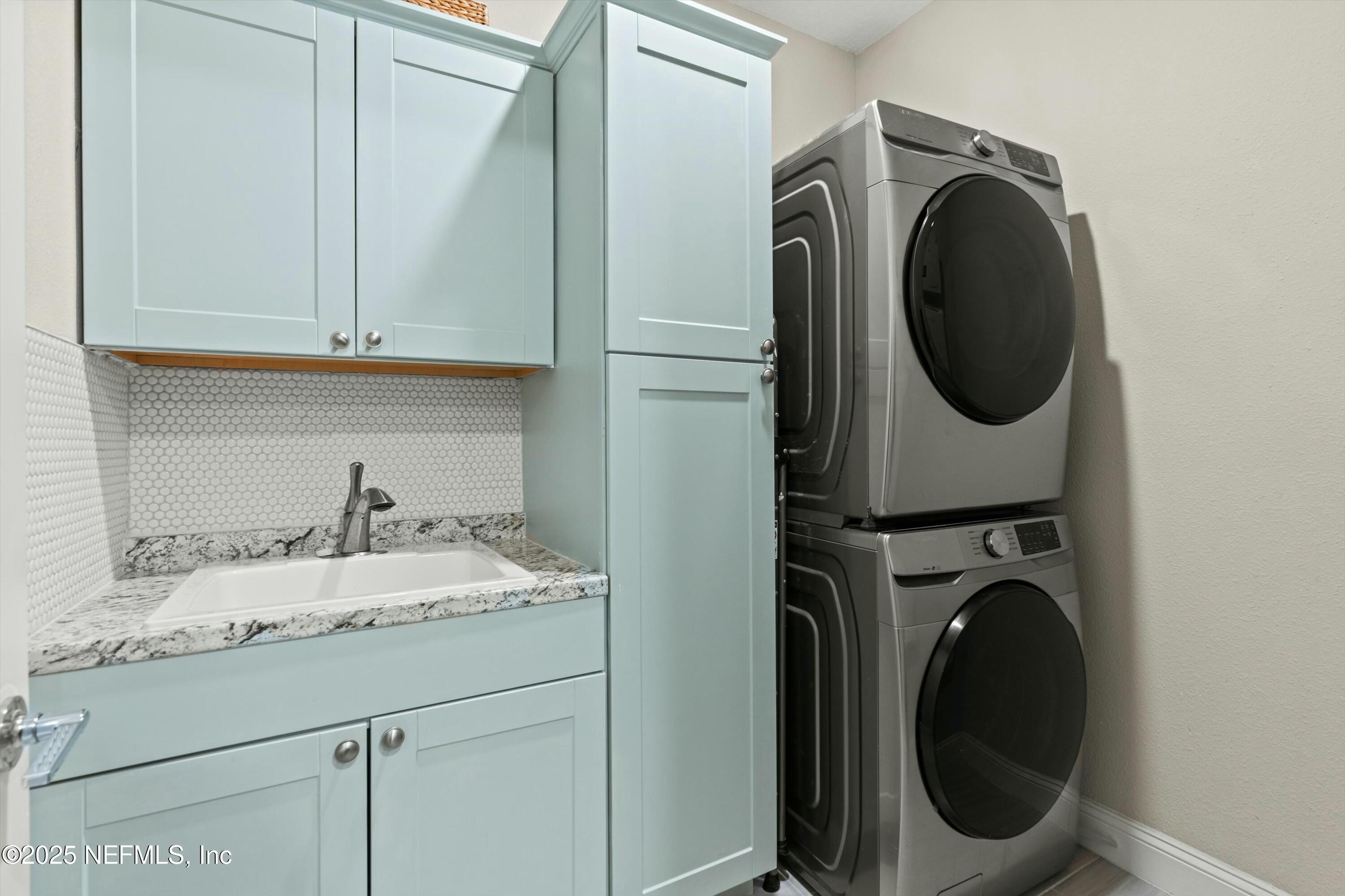 66 Silver Reef Lane St. Augustine, FL 32095 - Photo 39 of 46 a utility room with sink dryer and washer