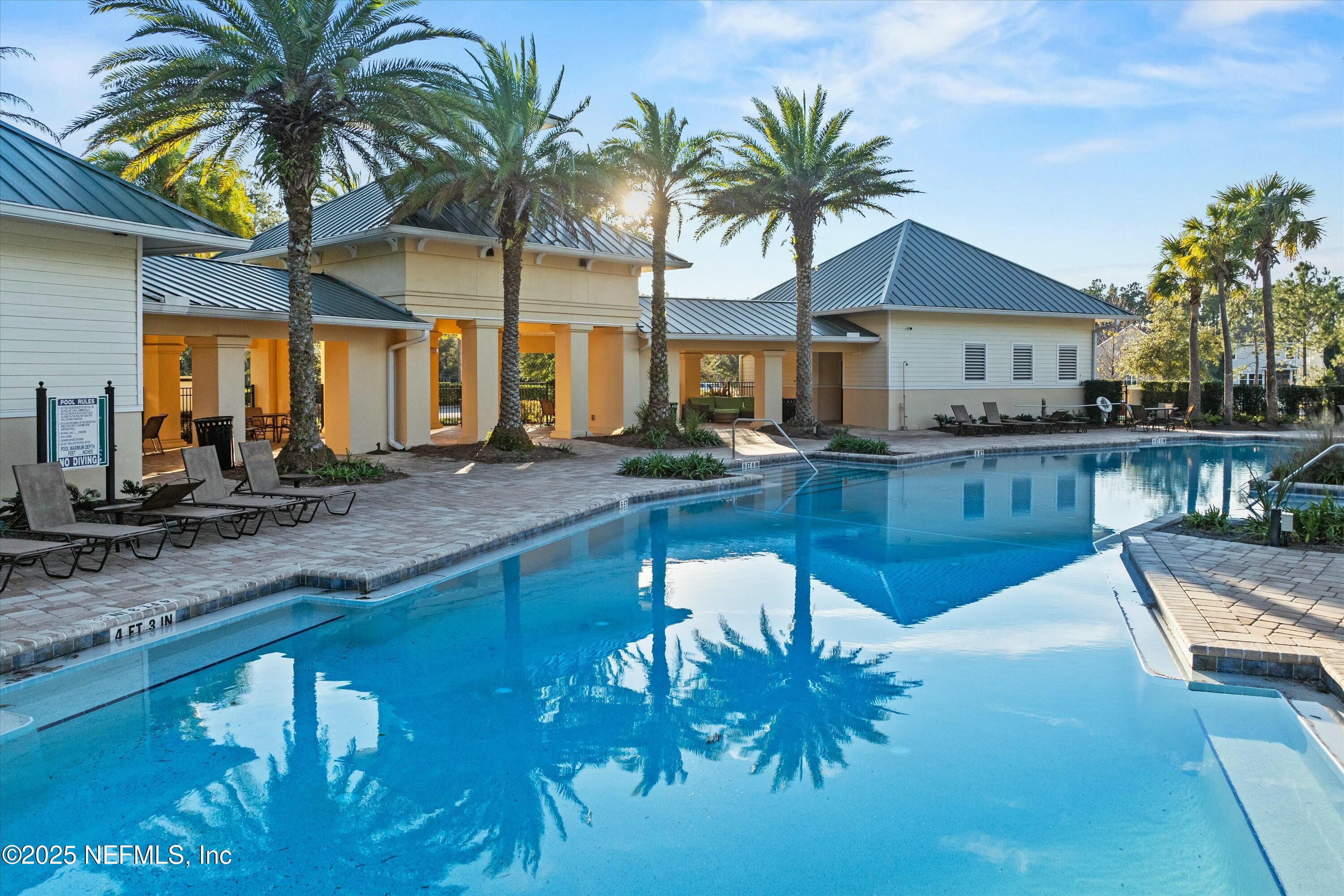 66 Silver Reef Lane St. Augustine, FL 32095 - Photo 43 of 46 a view of a swimming pool and lounge chair