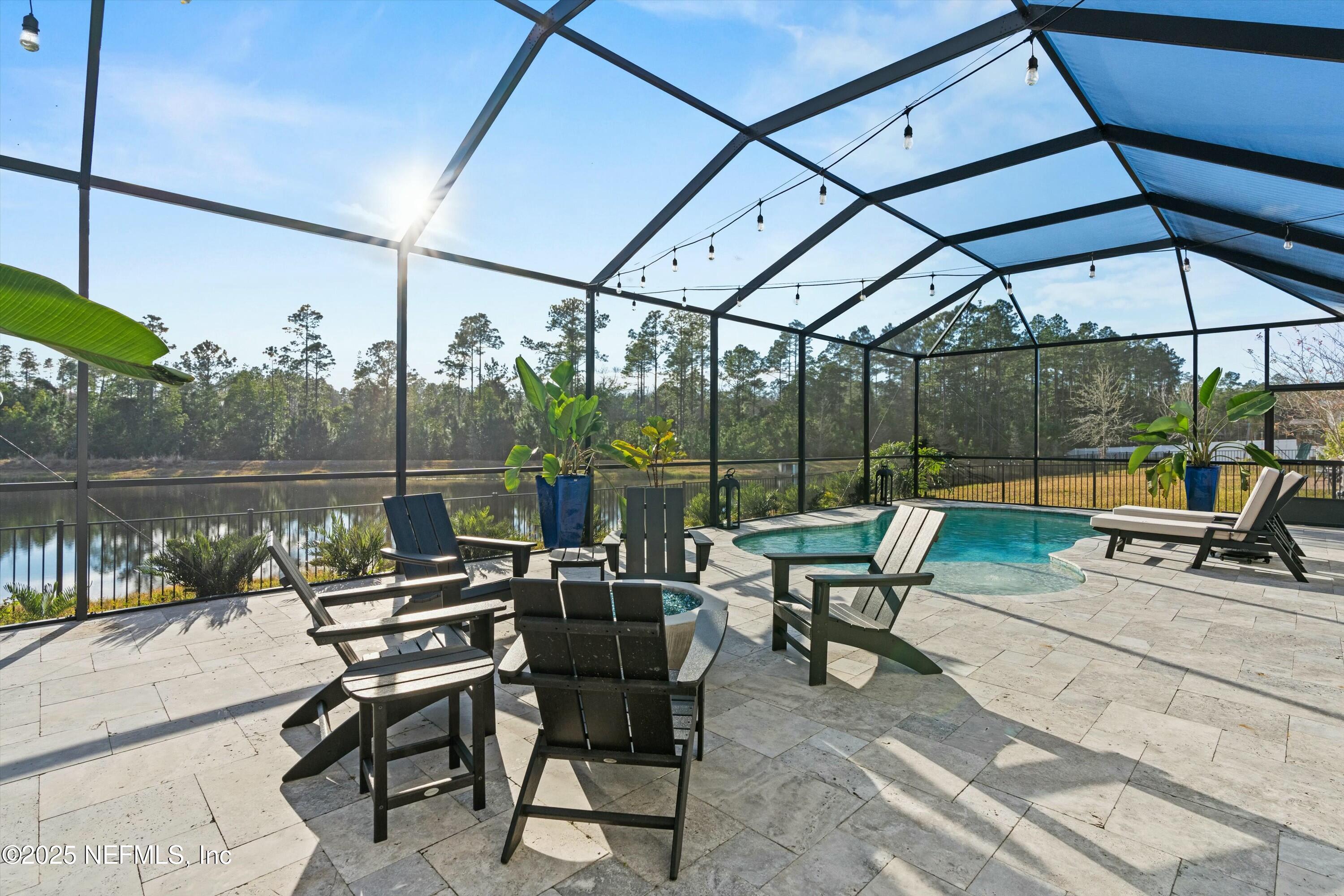66 Silver Reef Lane St. Augustine, FL 32095 - Photo 5 of 46 a sitting area with furniture and outdoor view
