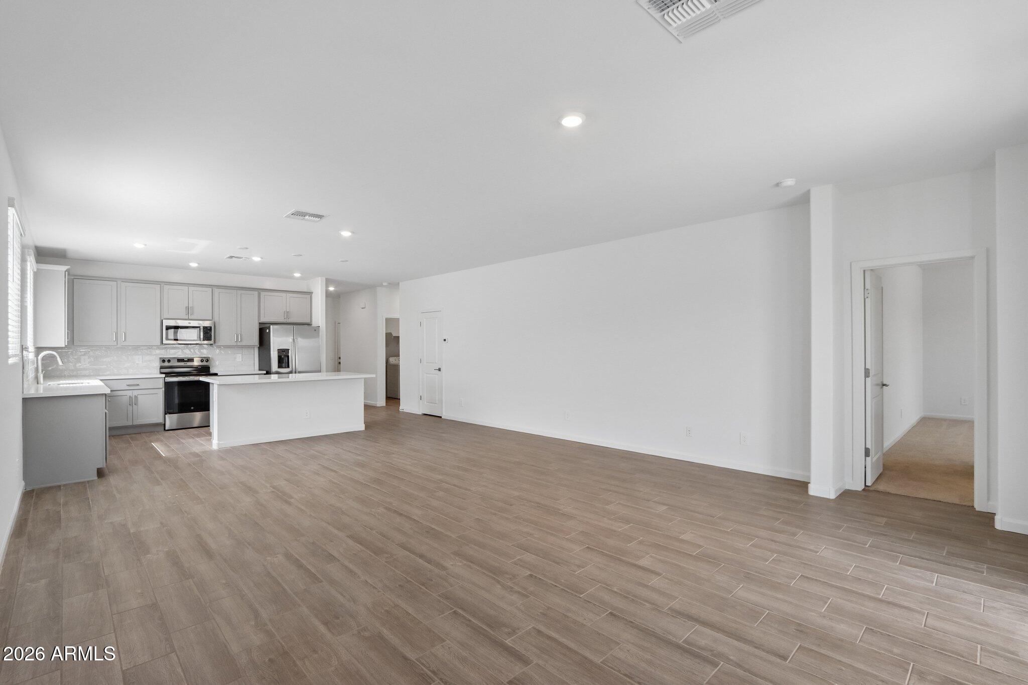 9544 West Gaby Road Tolleson, AZ 85353 - Photo 7 of 43 a view of kitchen with wooden floor