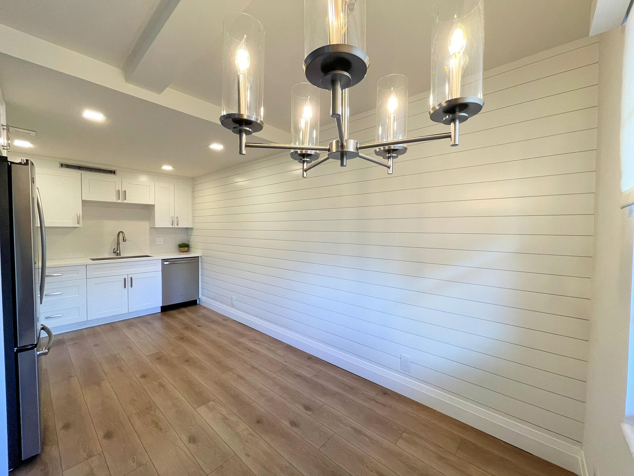 1030 Rexford B Boca Raton, FL 33434 - Photo 7 of 27 a view of a kitchen with a sink and wooden floor