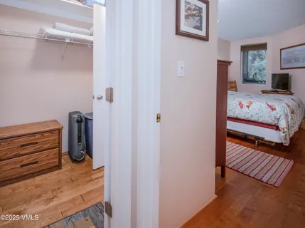 a bedroom with a bed and the view of bedroom