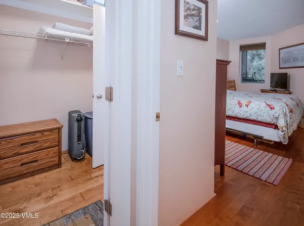a bedroom with a bed and the view of bedroom