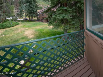 a view of a yard from a balcony