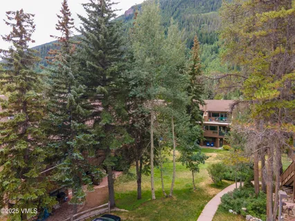 a aerial view of a house with a yard