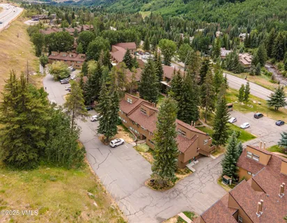 an aerial view of residential houses with outdoor space