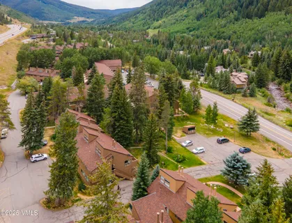 an aerial view of residential houses with outdoor space