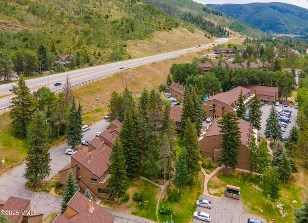 an aerial view of residential houses with outdoor space