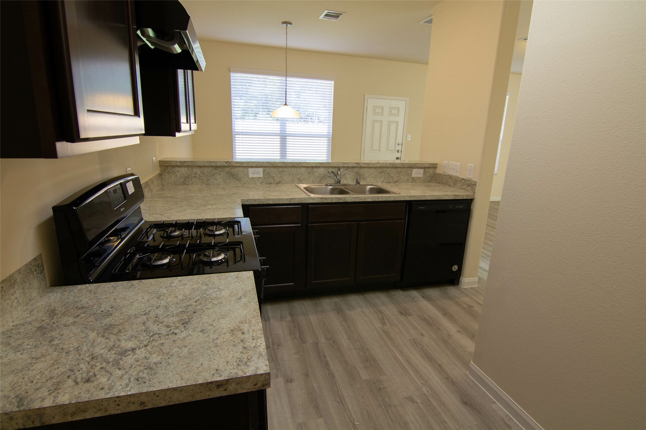 12738 Veterans Silver Road Houston, TX 77014 - Photo 2 of 12 a kitchen with a sink and cabinets