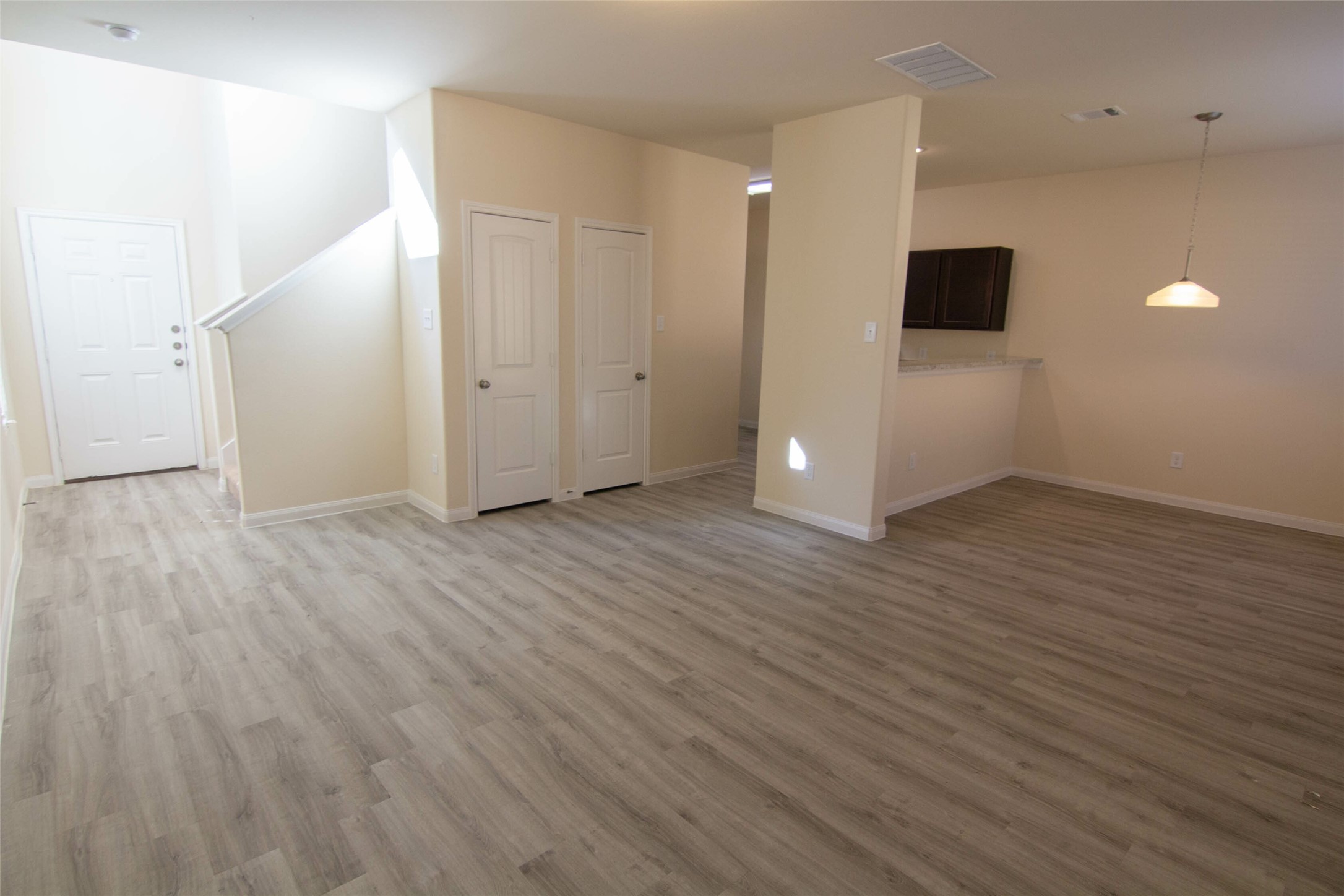 12738 Veterans Silver Road Houston, TX 77014 - Photo 4 of 12 an empty room with wooden floor and windows