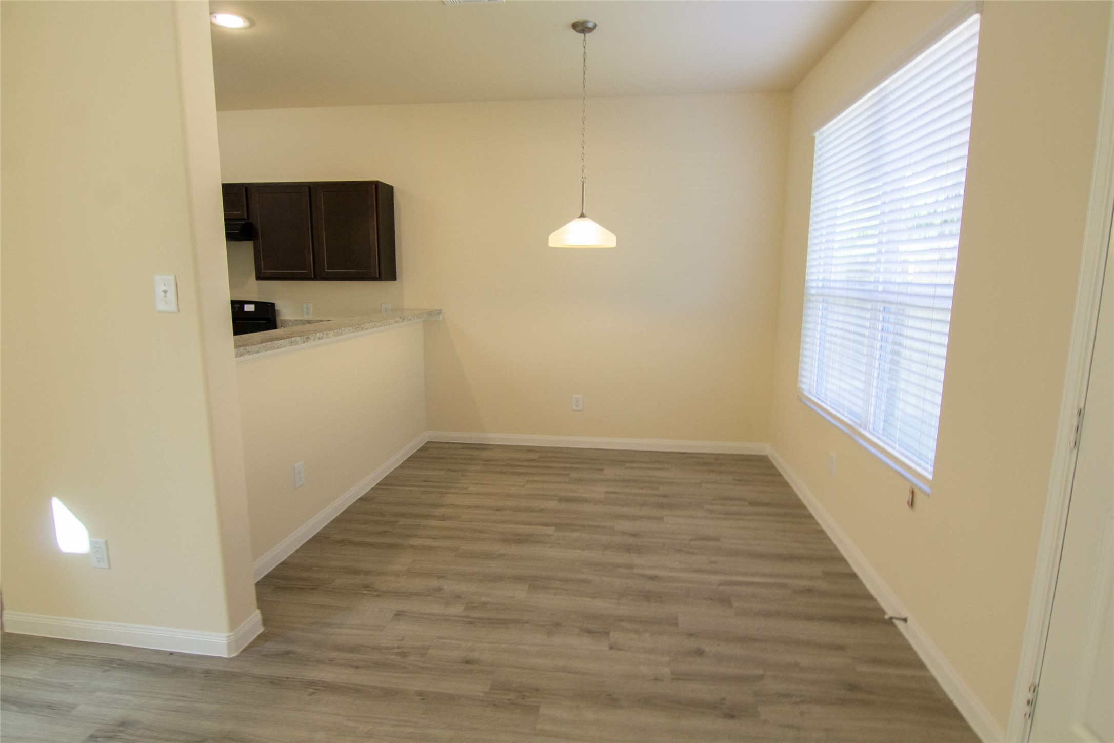 12738 Veterans Silver Road Houston, TX 77014 - Photo 5 of 12 a view of a livingroom with wooden floor and a flat screen tv