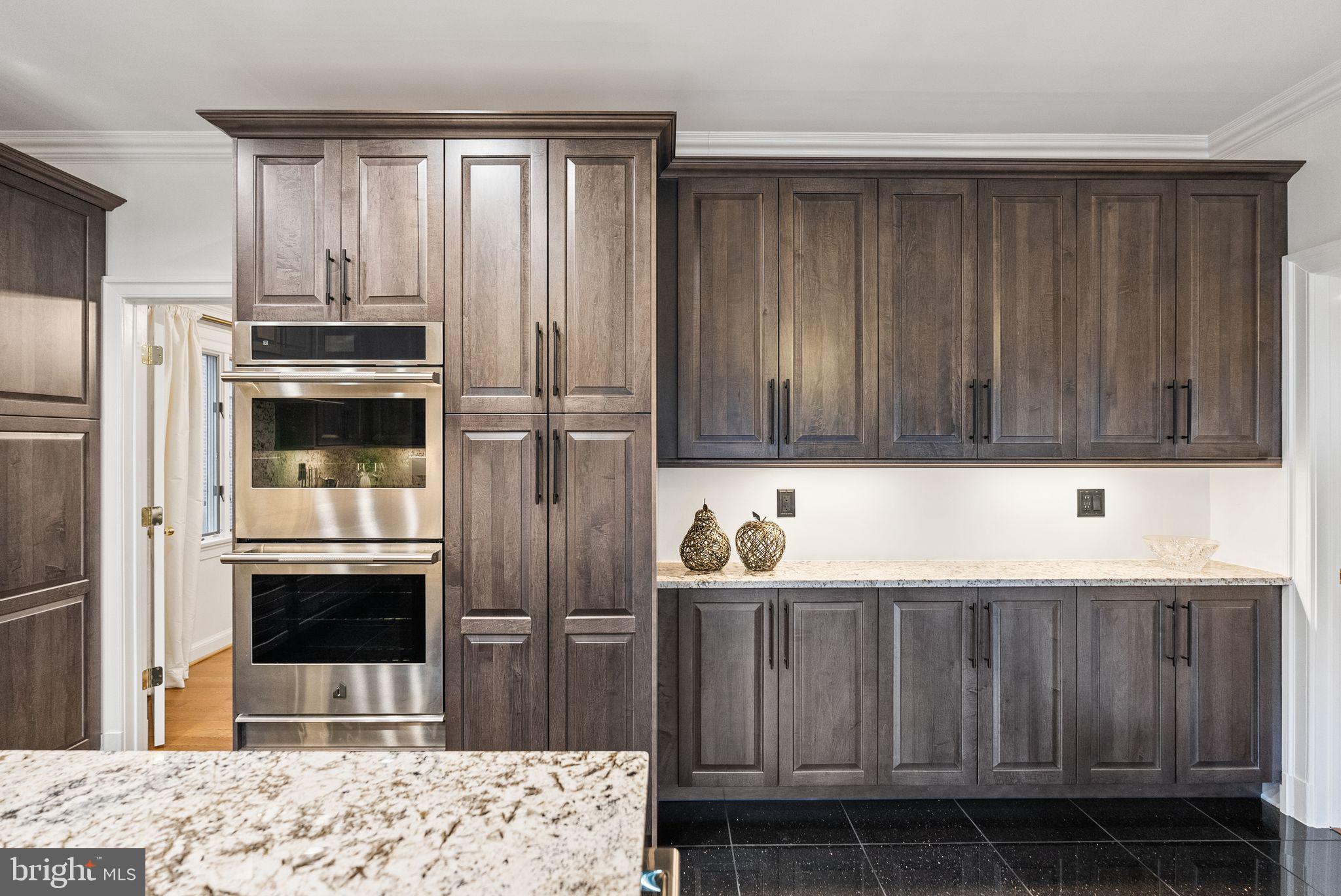 4613 Charleston Terrace Northwest Washington, DC 20007 - Photo 27 of 114 a kitchen with a sink and a refrigerator