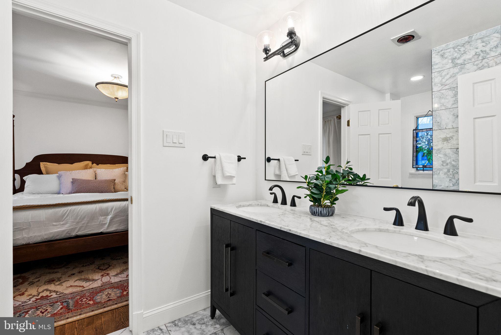 4613 Charleston Terrace Northwest Washington, DC 20007 - Photo 36 of 114 a bathroom with a sink and a mirror