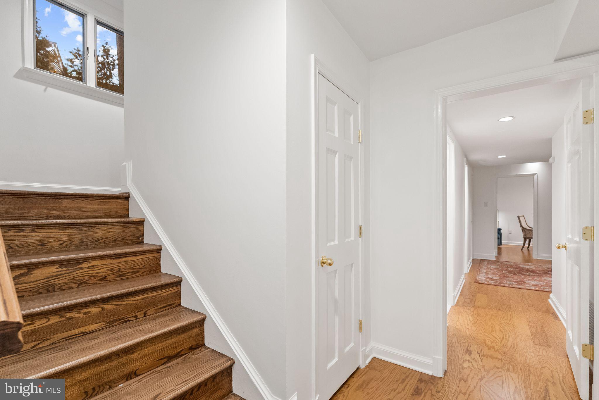 4613 Charleston Terrace Northwest Washington, DC 20007 - Photo 68 of 114 a view of a hallway with wooden floor and staircase