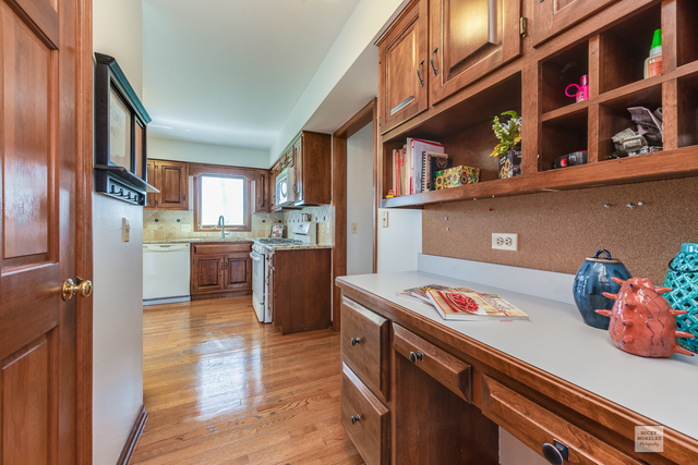 1812 Denison Road Naperville, IL 60565 - Photo 14 of 33 a kitchen with stainless steel appliances granite countertop a refrigerator and a stove top oven
