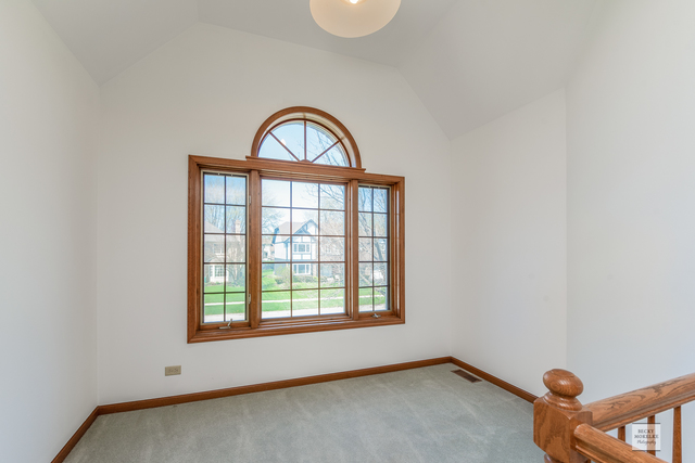 1812 Denison Road Naperville, IL 60565 - Photo 22 of 33 an empty room with a window