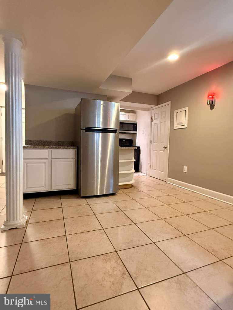 5923 Berwyn Road College Park, MD 20740 - Photo 35 of 51 a kitchen with granite countertop a refrigerator and a stove top oven