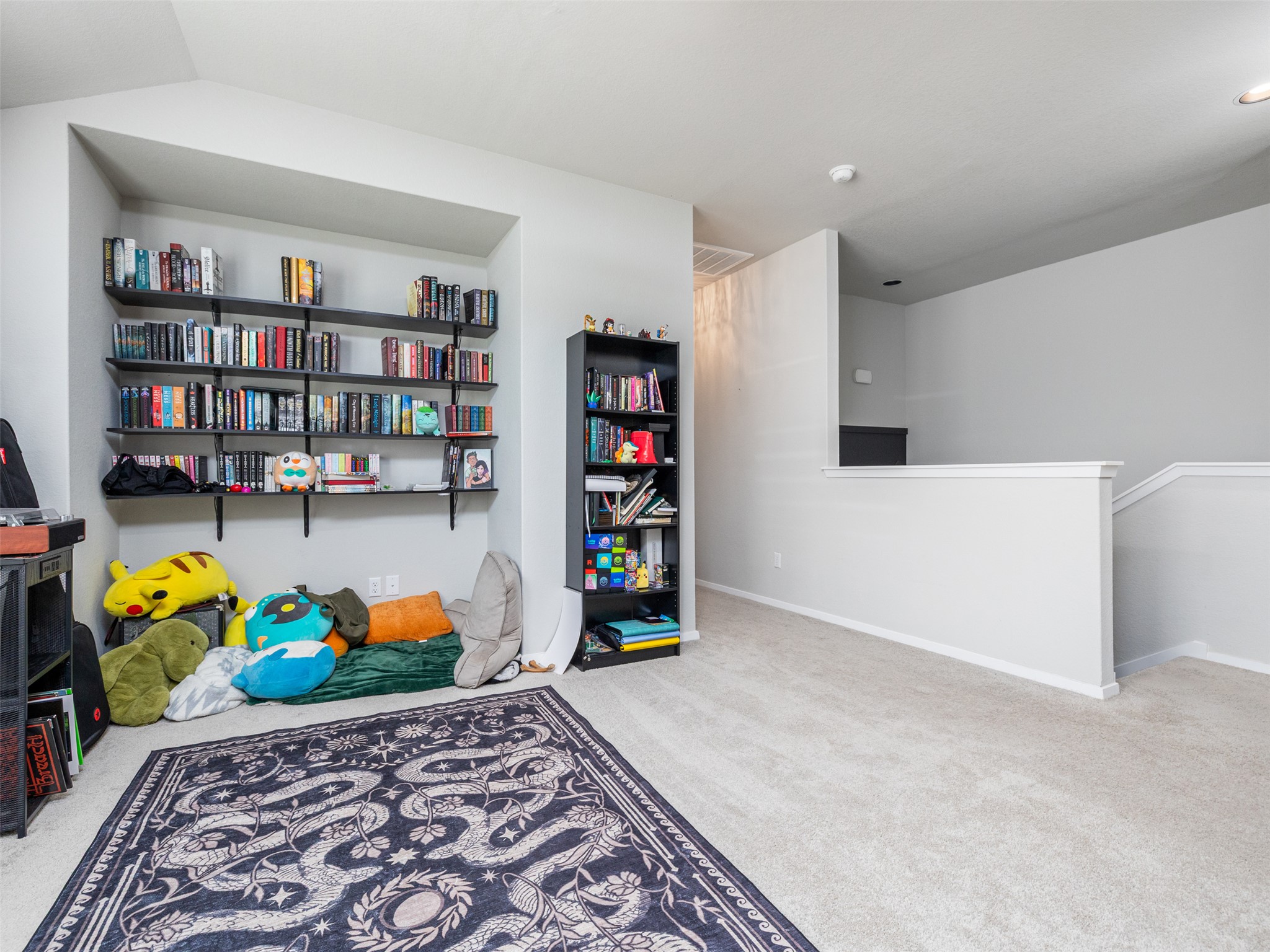 121 Graver Street Georgetown, TX 78626 - Photo 18 of 28 Built-in shelving provides abundant storage, complementing this adaptable bonus room.