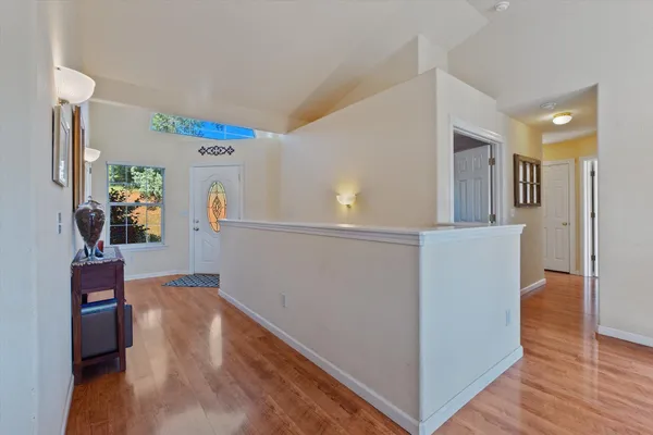 a bedroom with furniture and wooden floor
