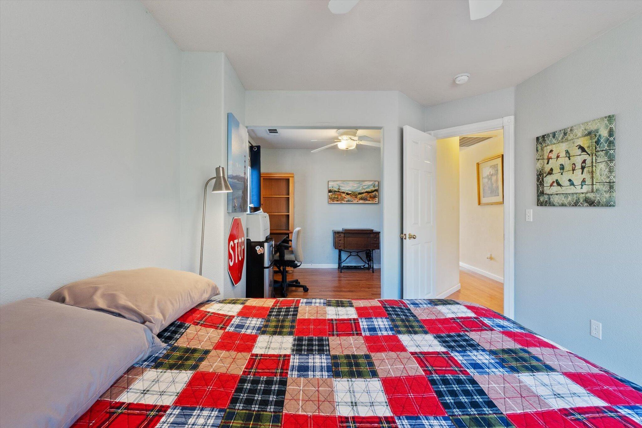 10067 Tilton Mine Road Redding, CA 96001 - Photo 16 of 62 a bedroom with a bed and walk in closet