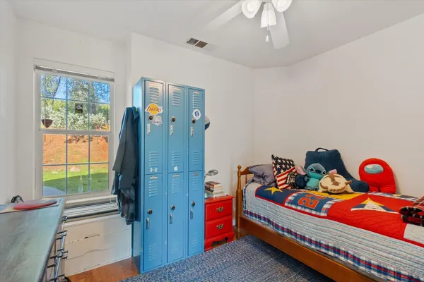 a view of a living room with furniture and a large window