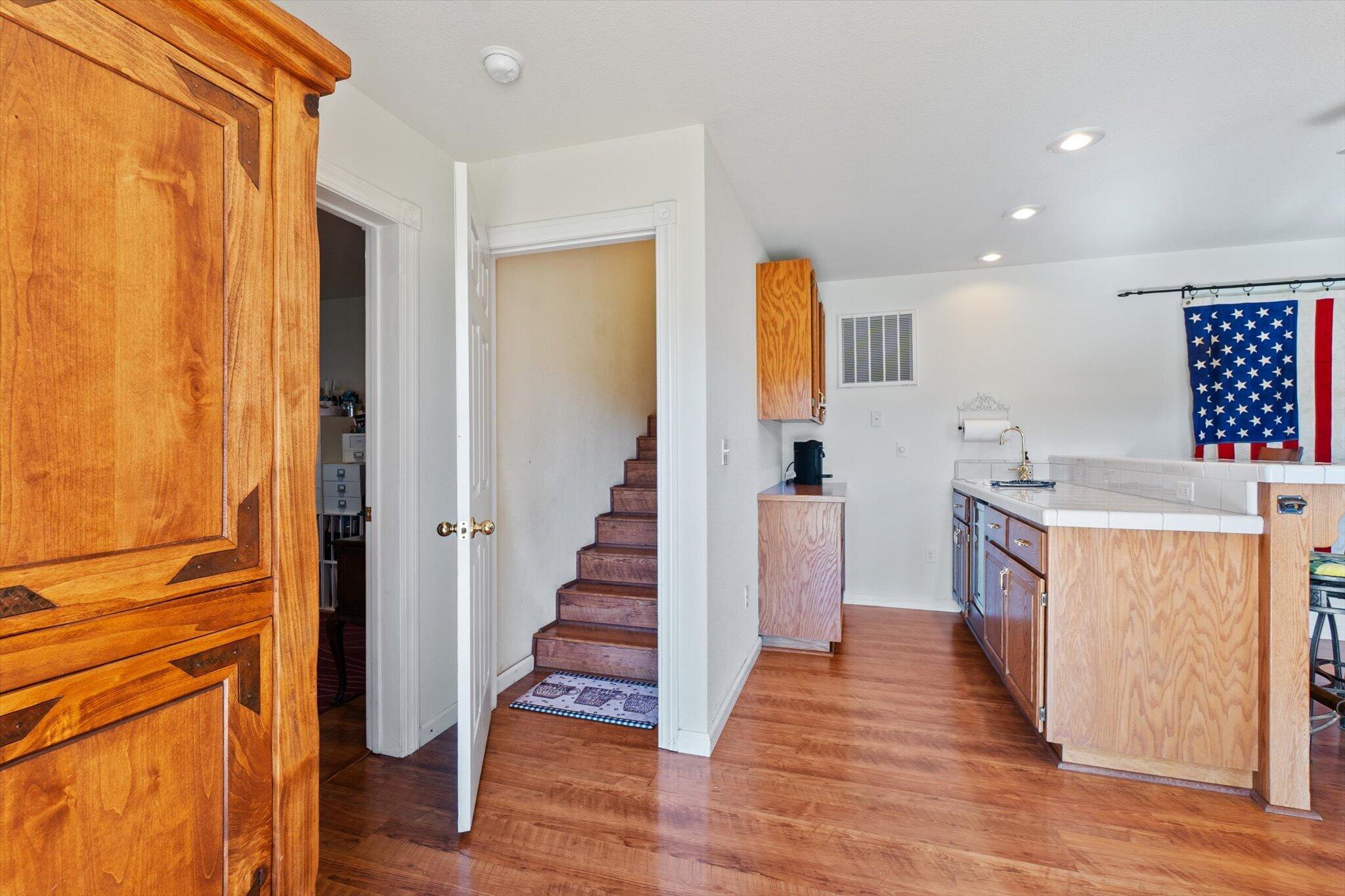 10067 Tilton Mine Road Redding, CA 96001 - Photo 22 of 62 a view of a kitchen cabinets and wooden floor