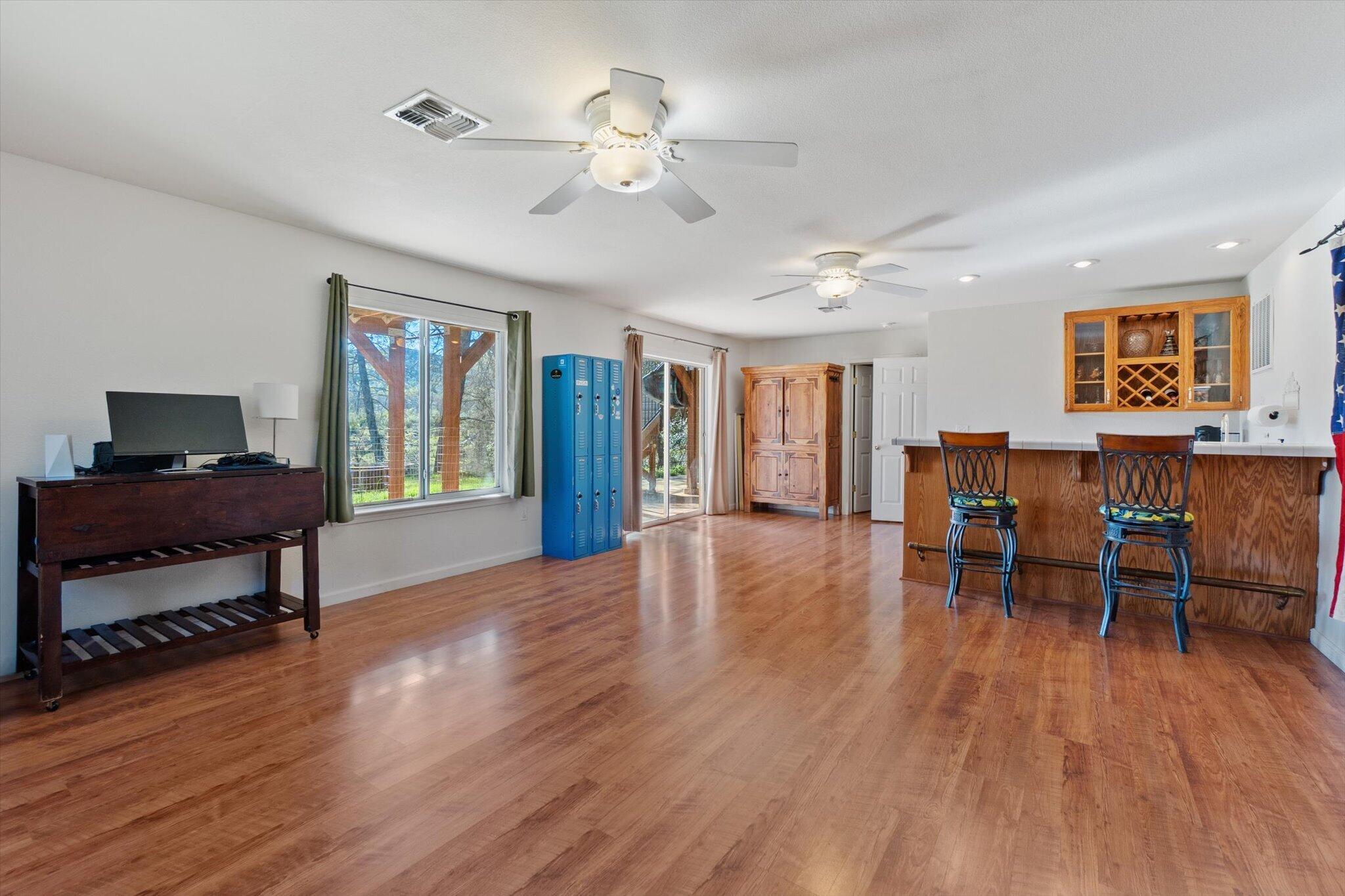 10067 Tilton Mine Road Redding, CA 96001 - Photo 25 of 62 a view of a workspace with furniture and a window