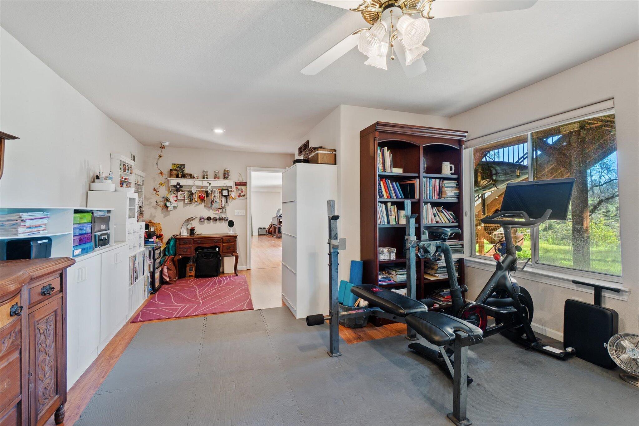 10067 Tilton Mine Road Redding, CA 96001 - Photo 27 of 62 a view of a room with gym equipment