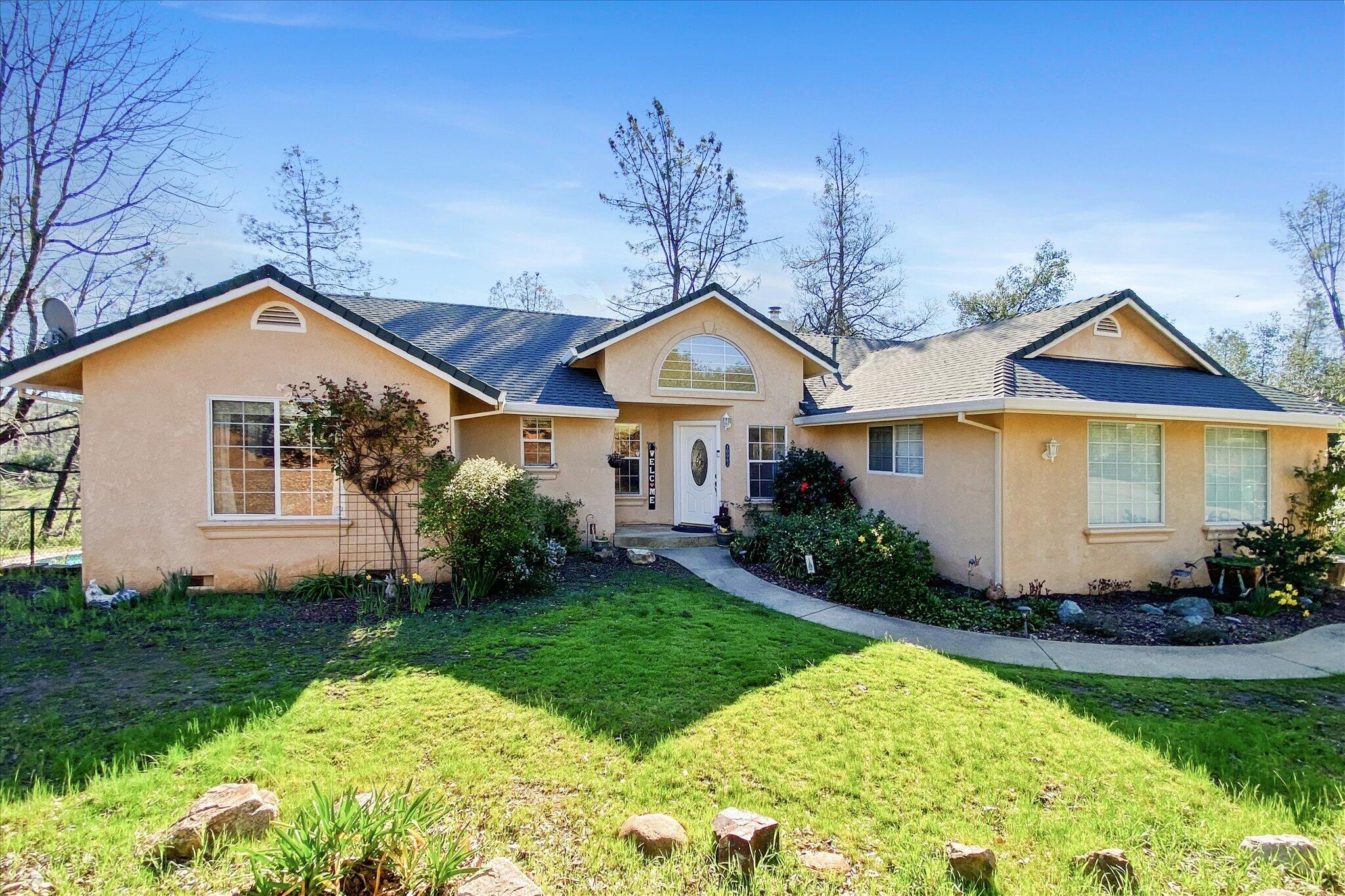 10067 Tilton Mine Road Redding, CA 96001 - Photo 33 of 62 a front view of a house with a yard