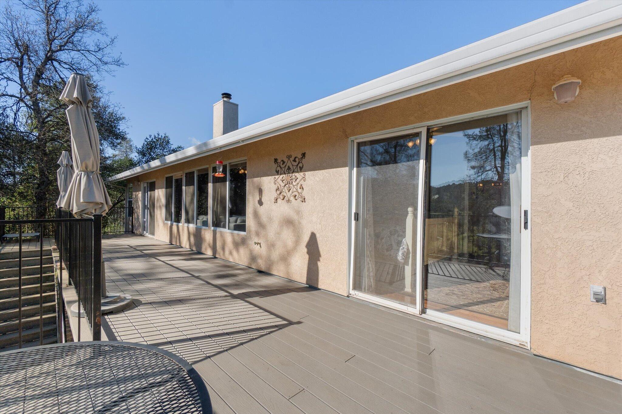 10067 Tilton Mine Road Redding, CA 96001 - Photo 35 of 62 a front view of a house with a glass door