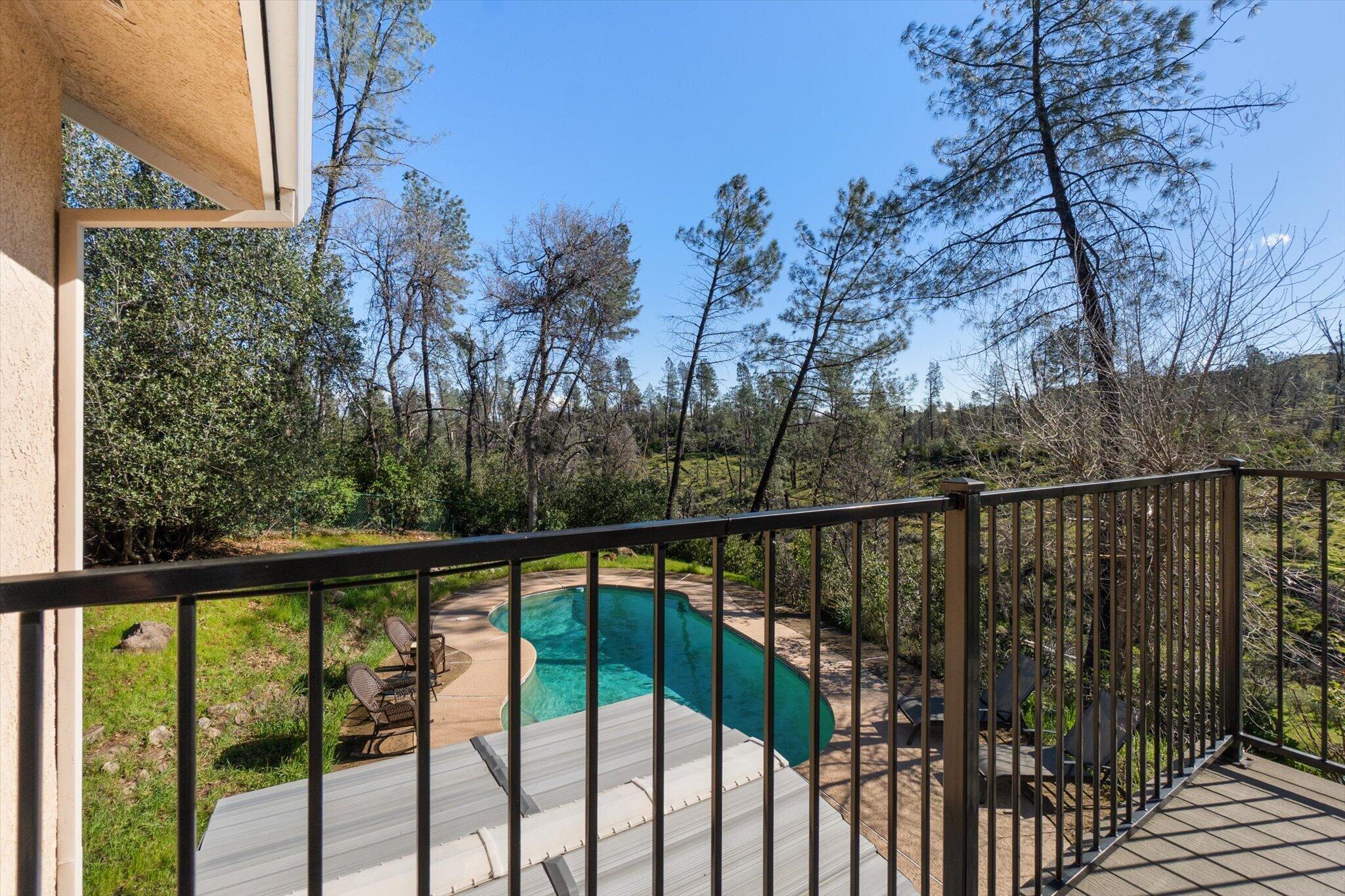 10067 Tilton Mine Road Redding, CA 96001 - Photo 36 of 62 a view of a balcony with trees