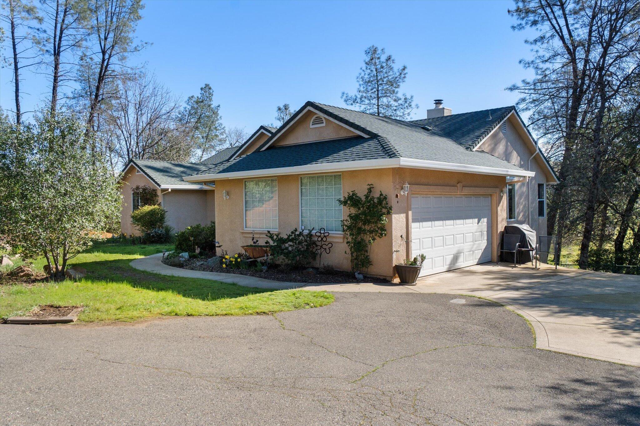 10067 Tilton Mine Road Redding, CA 96001 - Photo 43 of 62 a view of a house with outdoor space and garden