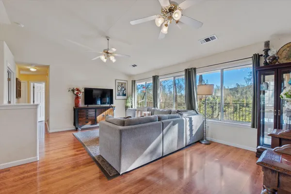 a kitchen with granite countertop a sink a stove and cabinets