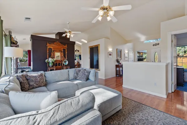 a living room with furniture and a large window