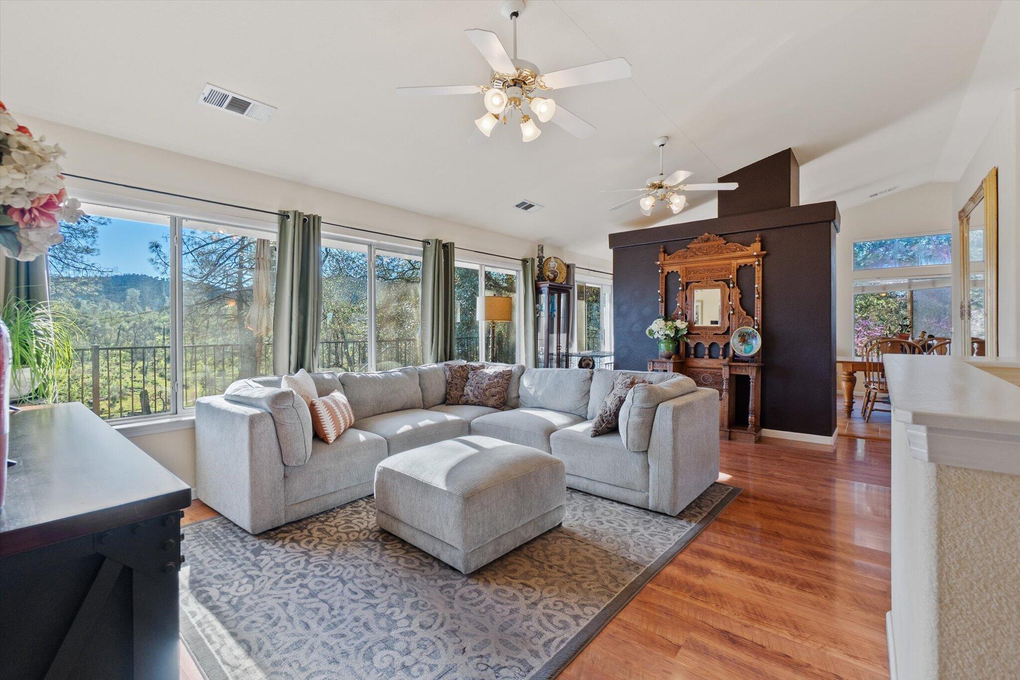 10067 Tilton Mine Road Redding, CA 96001 - Photo 10 of 62 a living room with furniture and a large window
