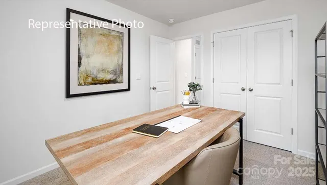 a room with a table and chairs