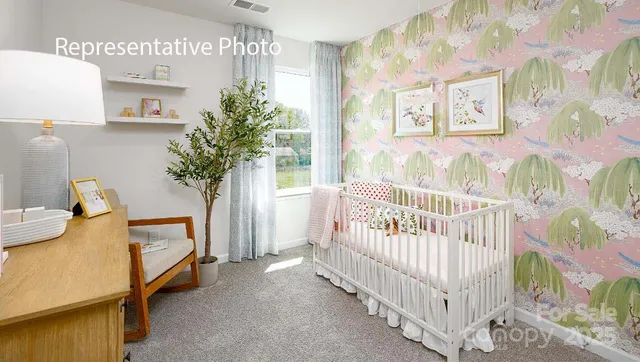 a bedroom with furniture and a baby crib