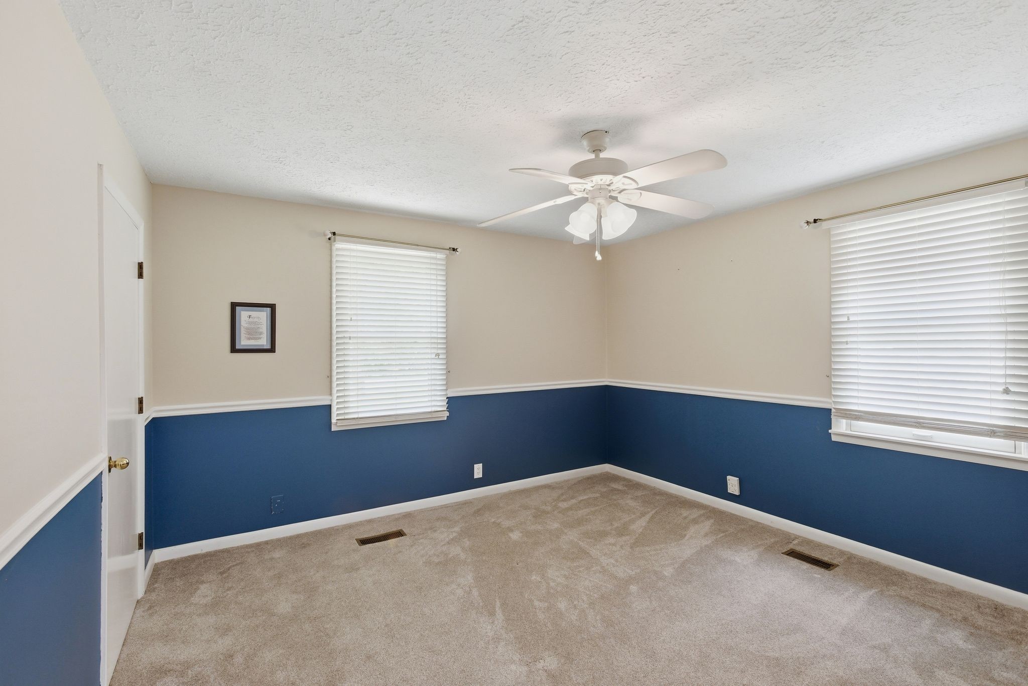 580 Defeated Creek Road Centerville, TN 37033 - Photo 33 of 71 a view of a big room with windows and chandelier fan
