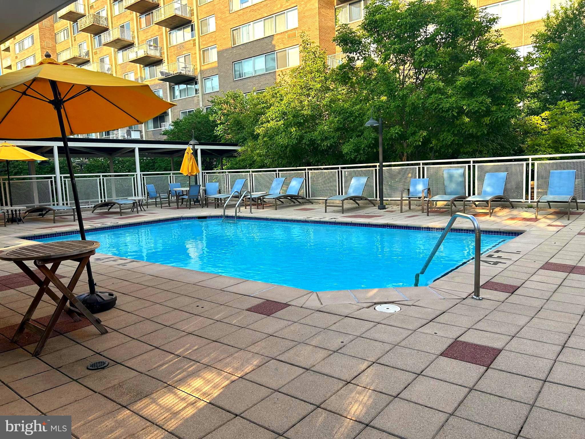 800 4th Street Southwest, Unit S721 Washington, DC 20024 - Photo 37 of 39 a view of a swimming pool with a lounge chair