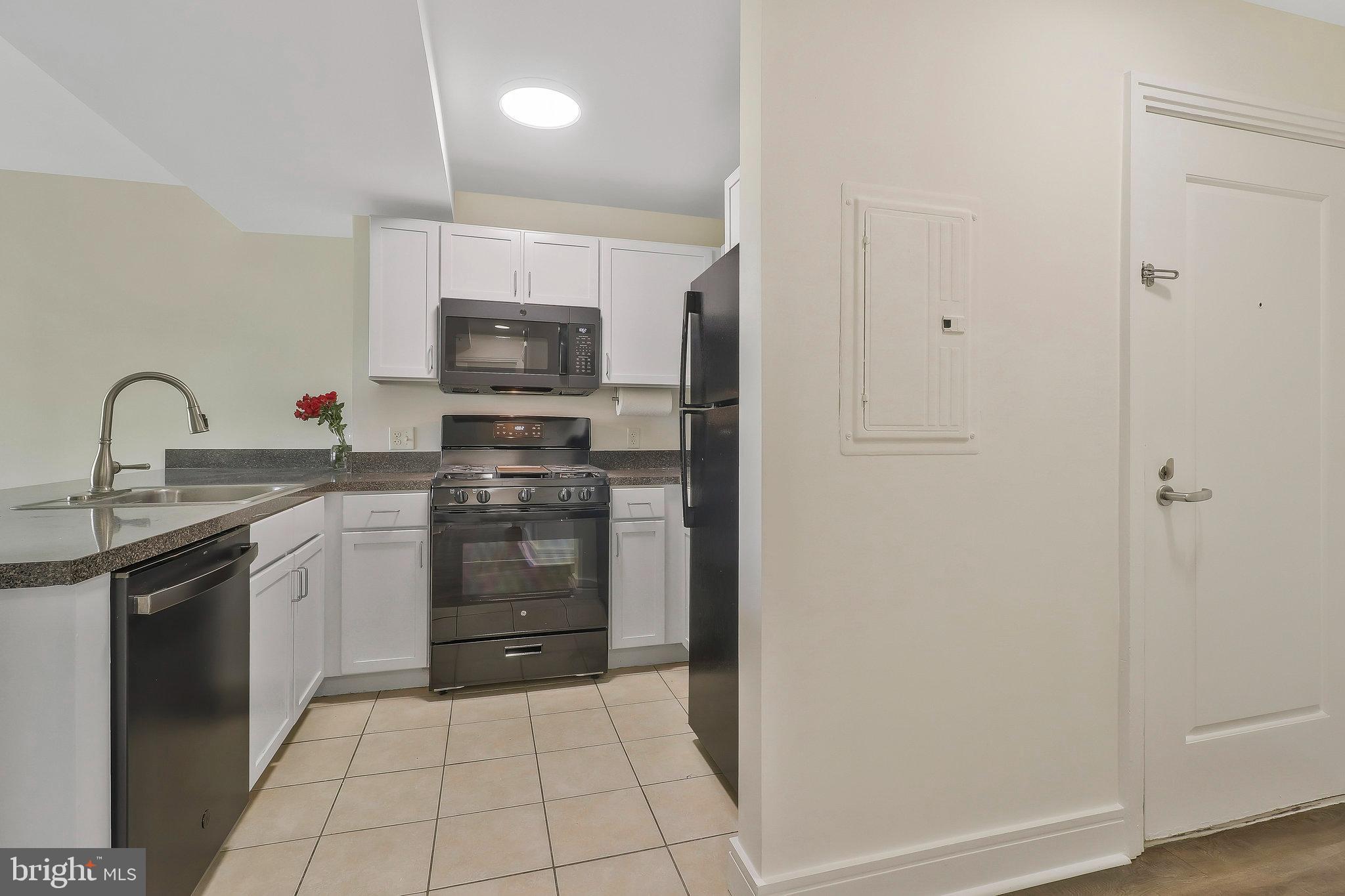 800 4th Street Southwest, Unit S721 Washington, DC 20024 - Photo 6 of 39 a kitchen with a sink and a stove top oven