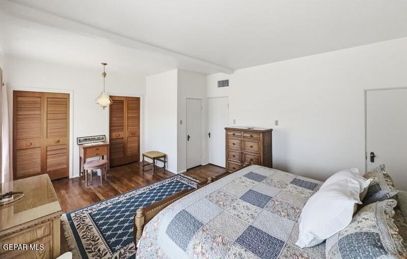 4135 Emory Road El Paso, TX 79922 - Photo 61 of 73 a bedroom with a bed and wooden floor