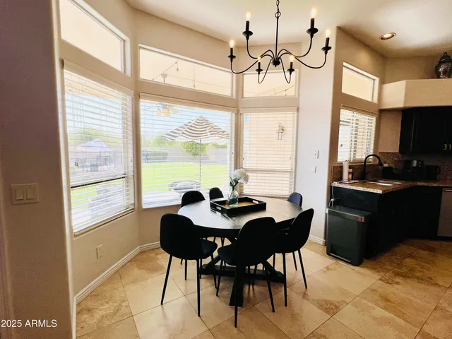 a view of a dining room with furniture window and outside view