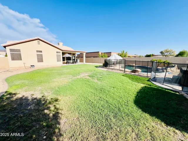 a bedroom with a bed and a table