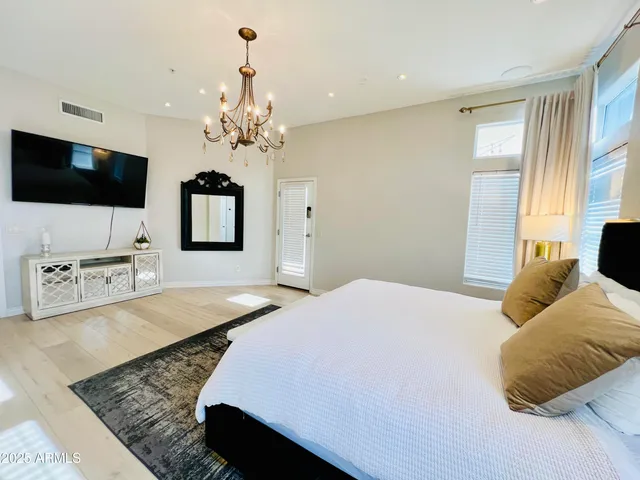 a bathroom with a sink a mirror and a shower