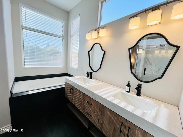 a bathroom with a shower and a mirror