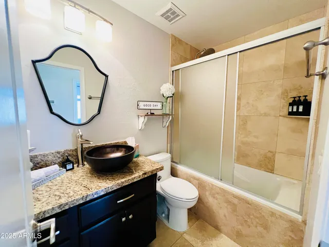 a view of a backyard with sitting area