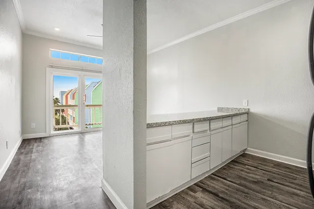 a view of a kitchen with an empty space and a sink