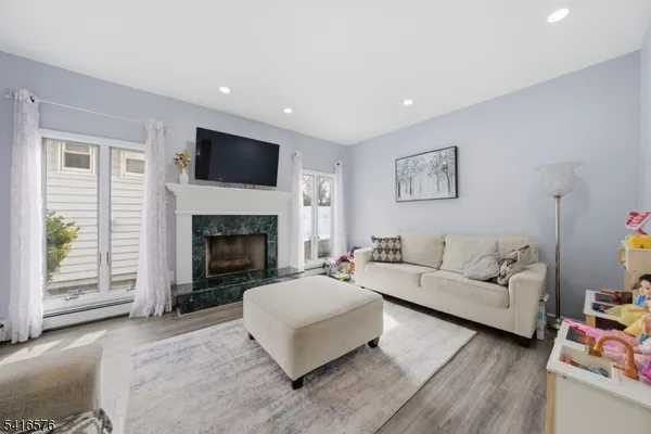 a living room with furniture and a fireplace