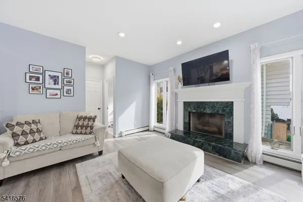 a living room with furniture and a fireplace