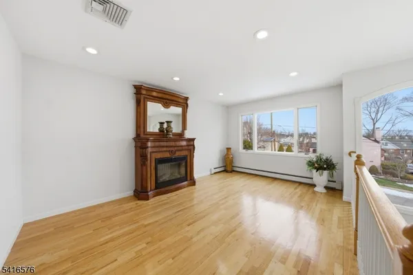 a view of a livingroom with furniture and a fireplace